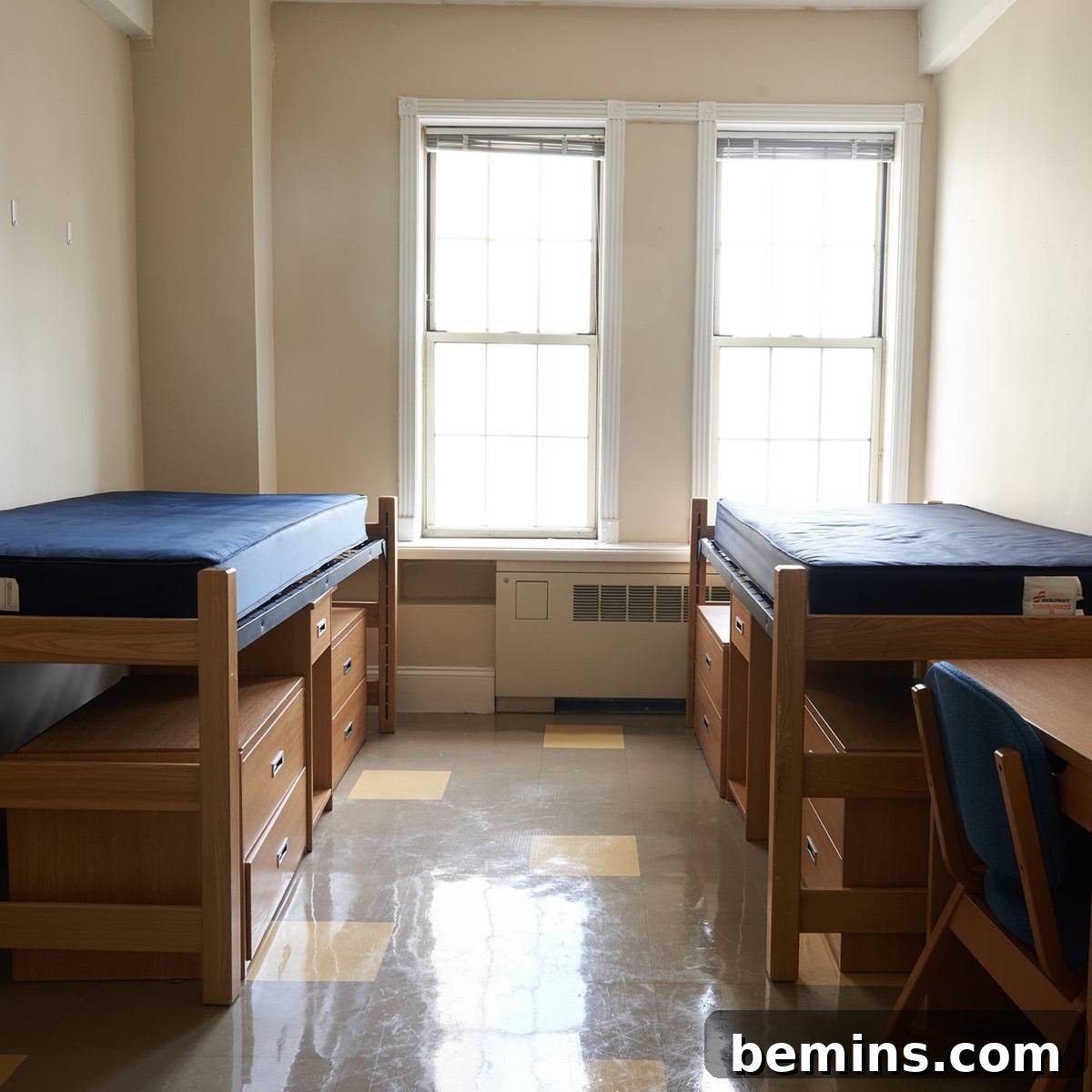 Before: Beds sit across from each other in a semi-empty dorm room.
