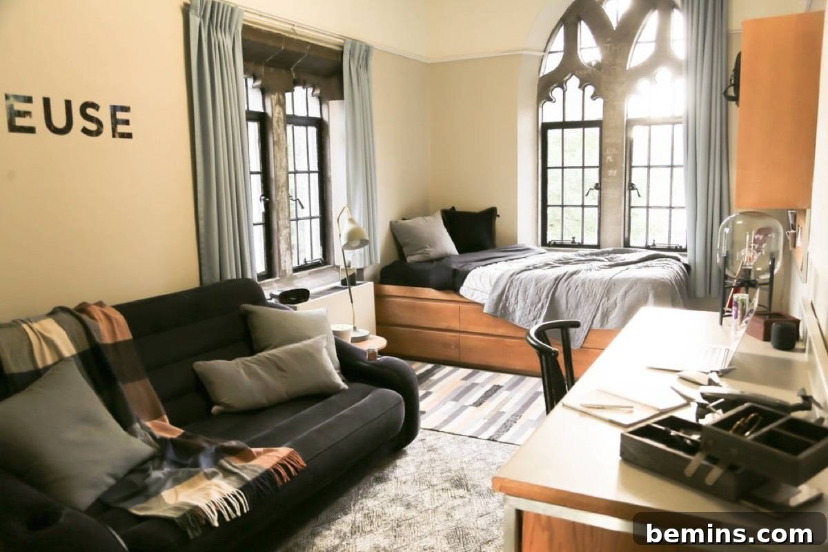 After: Home bedroom with a twin bed against a wall and a black futon couch on another wall.