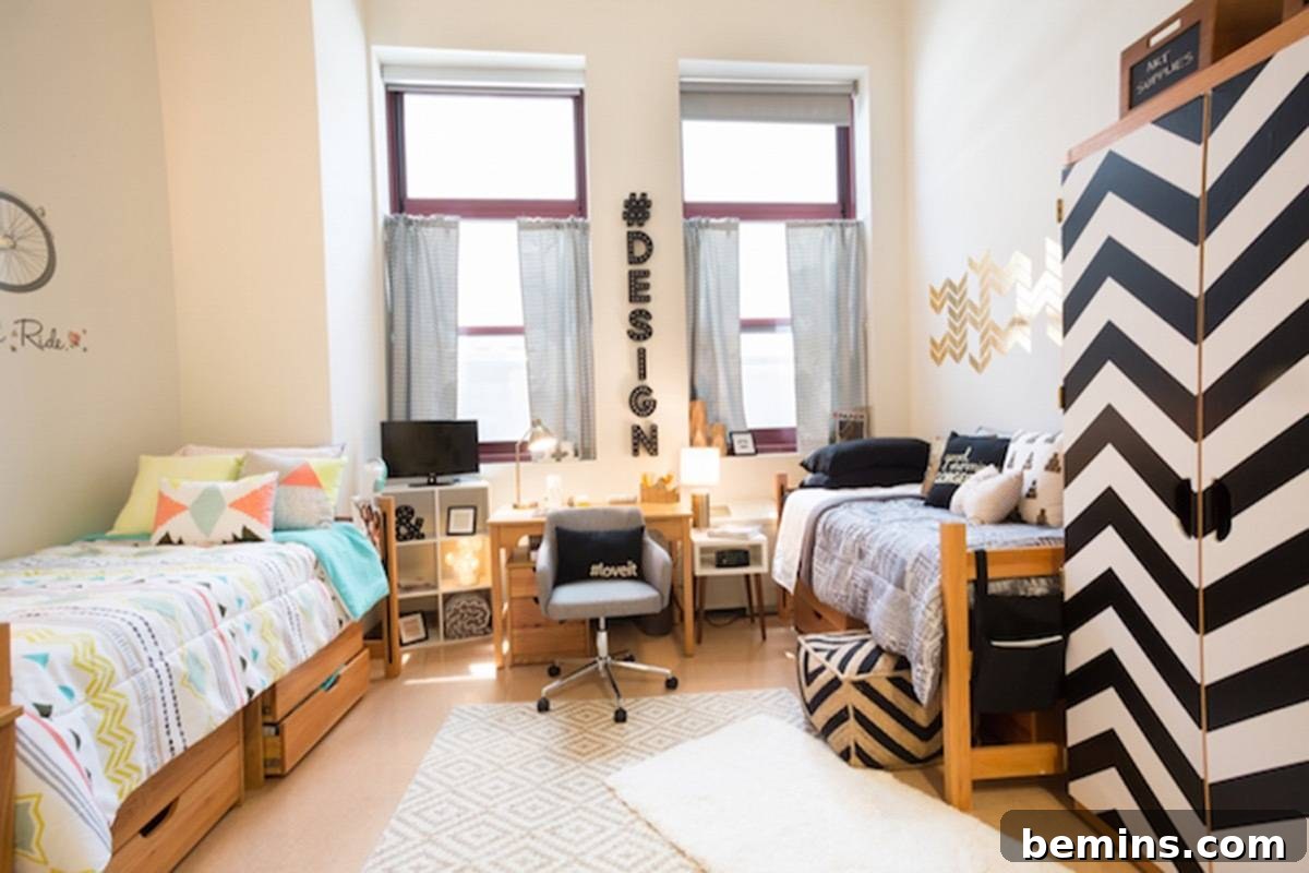 After: A computer desk is on the wall between two windows in a room with twin beds on each wall opposite each other.