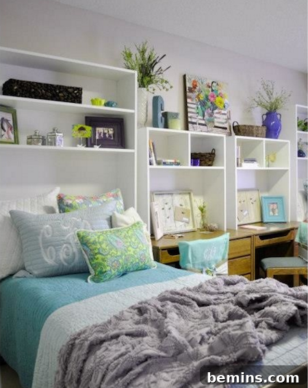 After: Aqua, green, and white dorm room with bed, desks, and extra shelving.