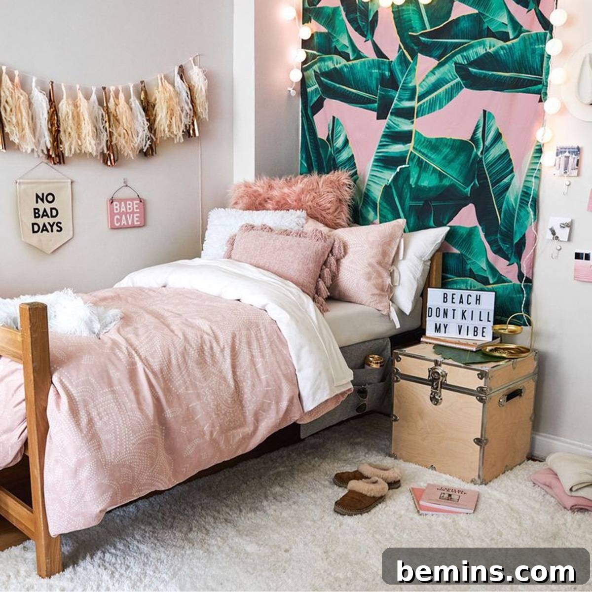After: A small bed near a pink and leafy looking wall.