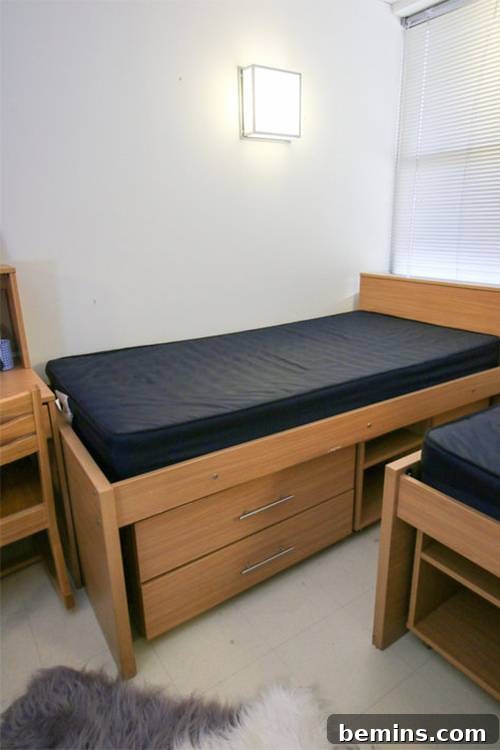 Before: Wooden bed with cot and drawers in the bed.