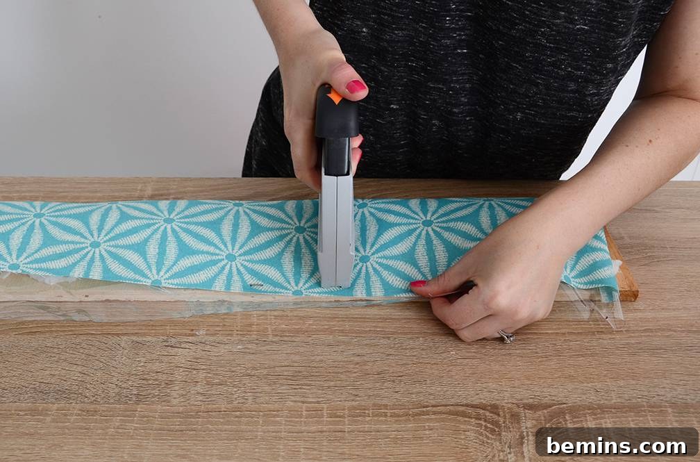 Craft Your Pup's Outdoor Oasis 11 Stapling stuffed fabric to dog bed