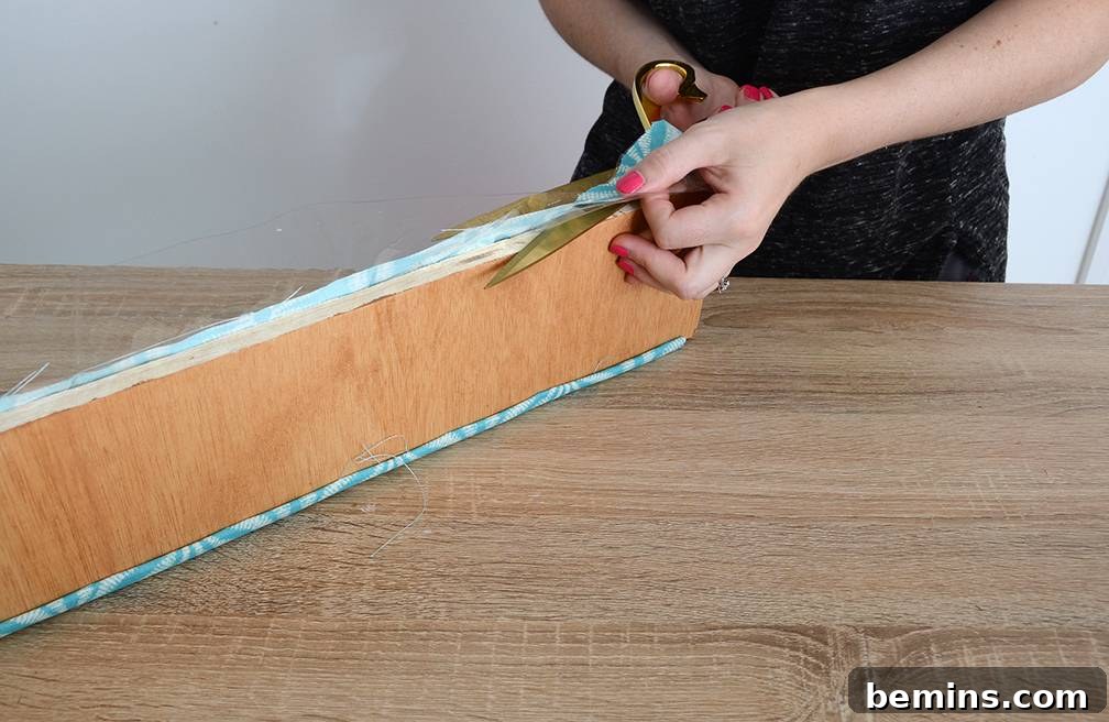 Craft Your Pup's Outdoor Oasis 12 Trimming excess fabric for dog bed