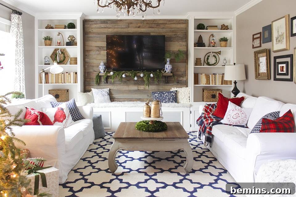 This living room is predominately white with splashes of color provided by throw pillows and a printed rug.