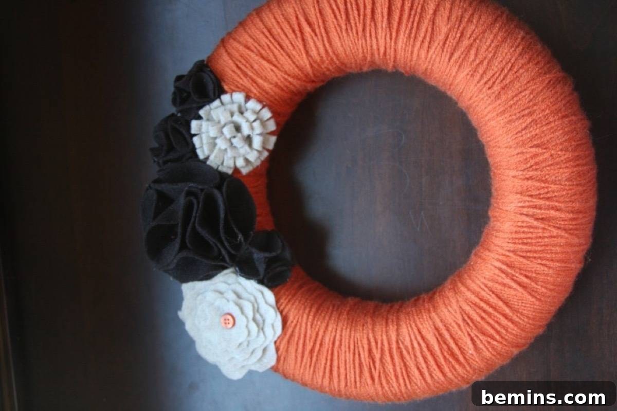 A yarn scrap wreath, a cute and colorful way to use up your yarn scraps for fall decor