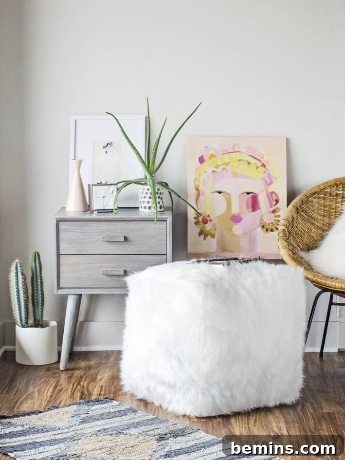 A faux fur pouf, adding a touch of luxury and comfort to your living space