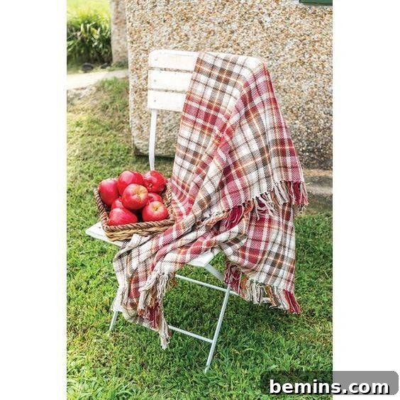 A cozy cotton plaid throw blanket, perfect for adding a touch of warmth and style to your living space