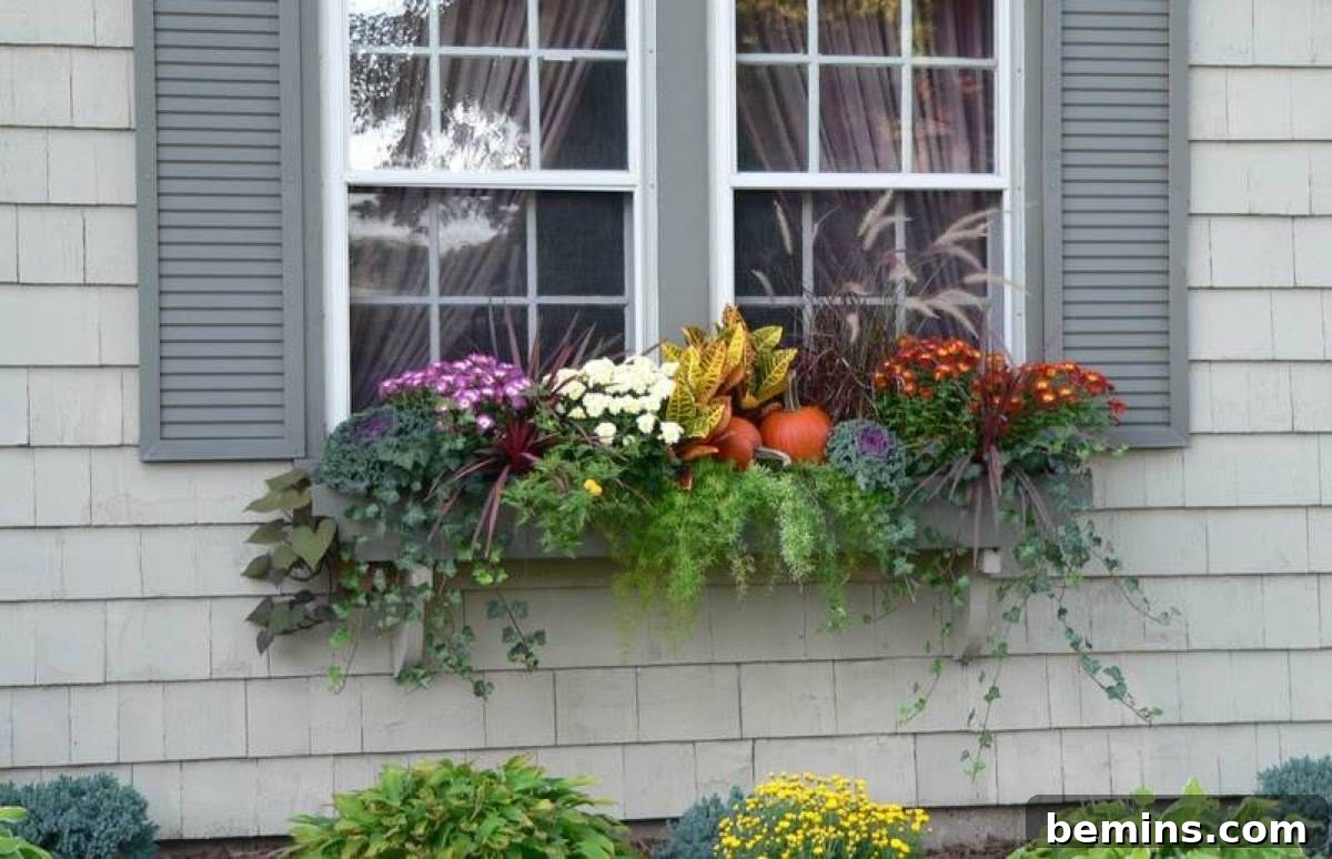 A window box overflowing with fall foliage, an easy way to add autumnal flair to your home's exterior