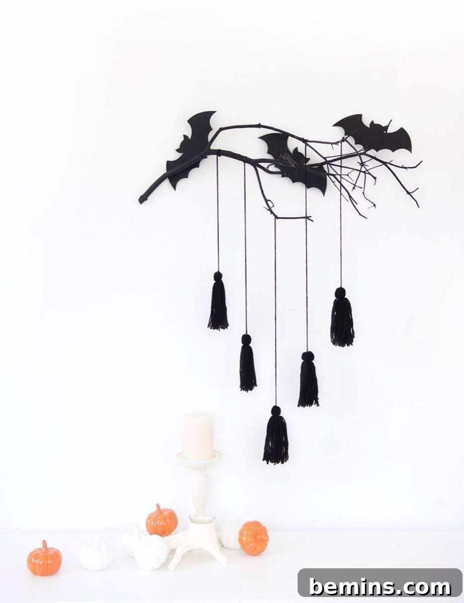 50+ Spooktacular DIY Halloween Home Decor Ideas 13 Minimal monochromatic wall decor