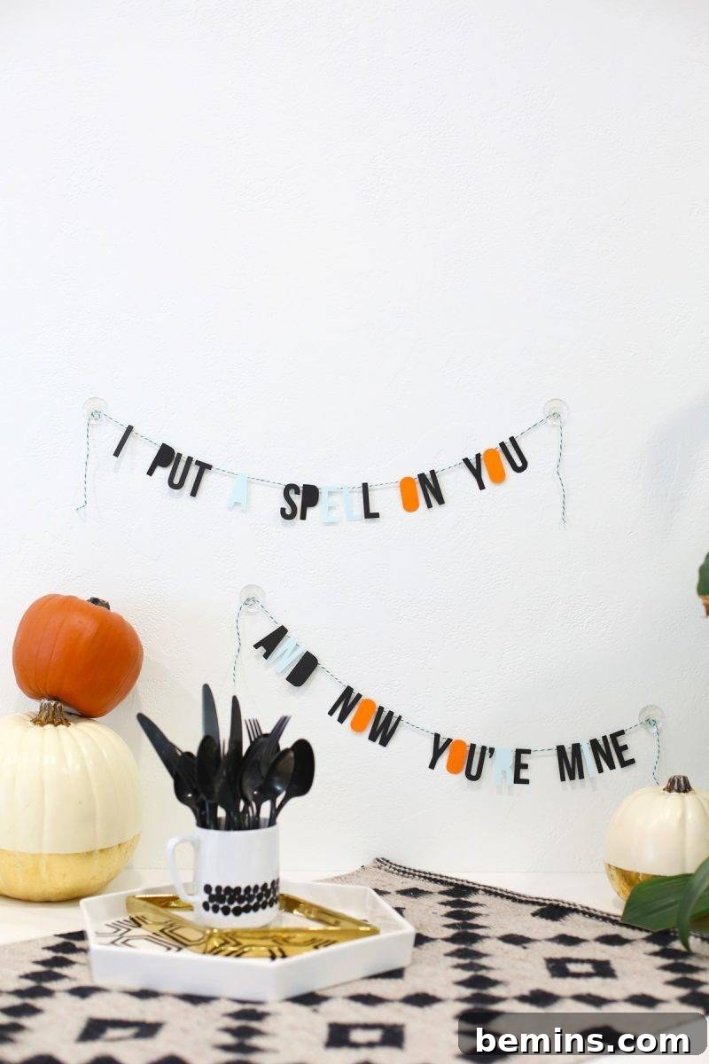 50+ Spooktacular DIY Halloween Home Decor Ideas 14 Banners decorating a table for a celebration.