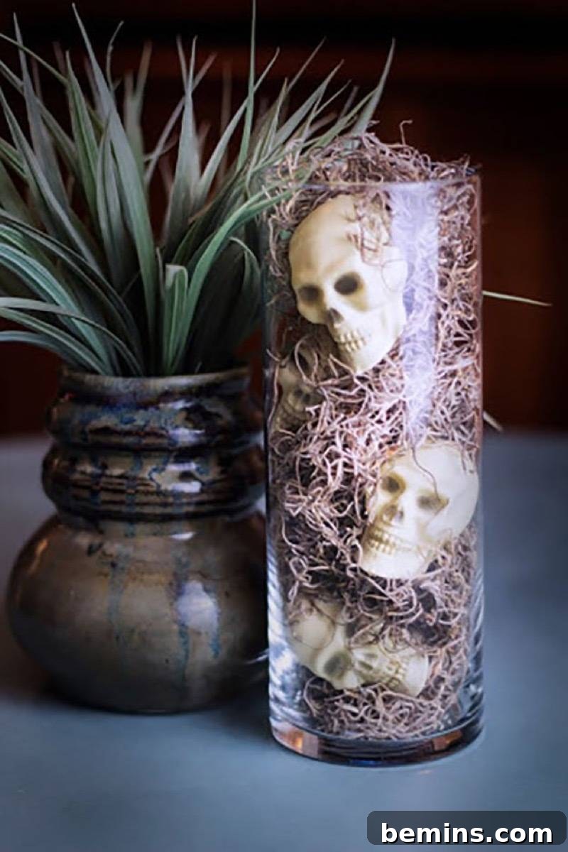 50+ Spooktacular DIY Halloween Home Decor Ideas 24 Skulls in a vase