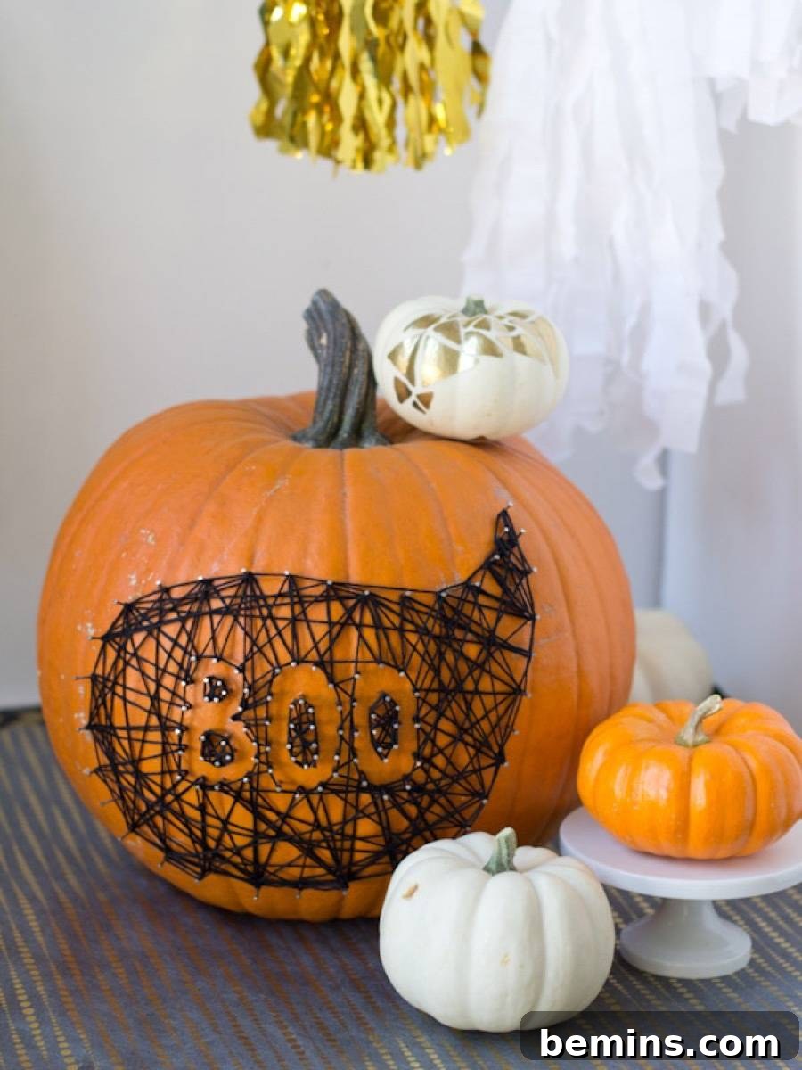 50+ Spooktacular DIY Halloween Home Decor Ideas 27 String art on pumpkin