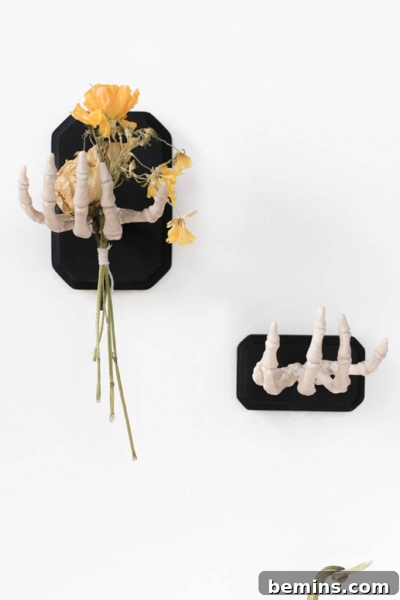 50+ Spooktacular DIY Halloween Home Decor Ideas 6 Wall-mounted skeleton hands