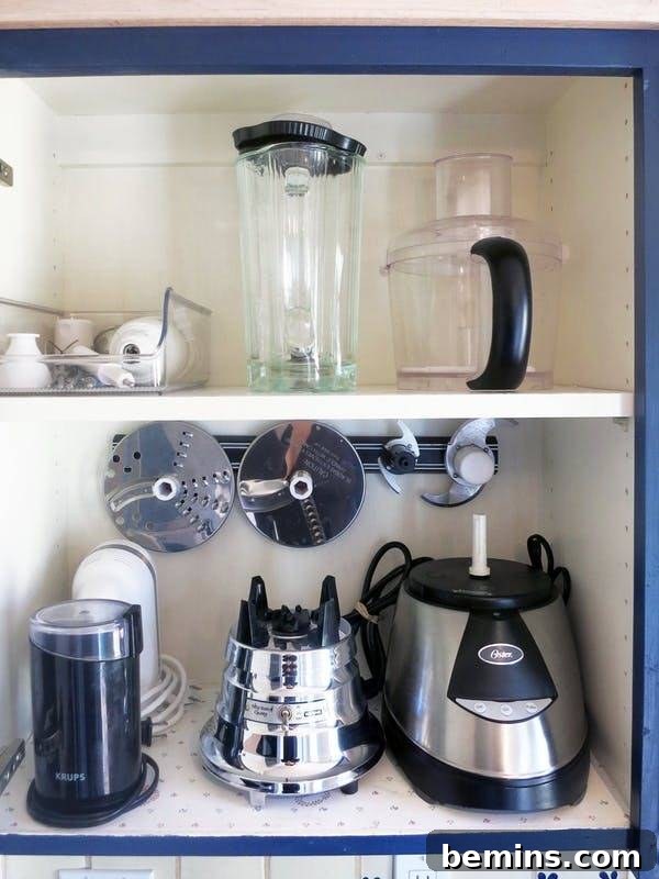 Magnetic Strips: Your Ultimate Home Organization Hack 5 Food processor blades stored on a magnetic knife strip inside a cabinet