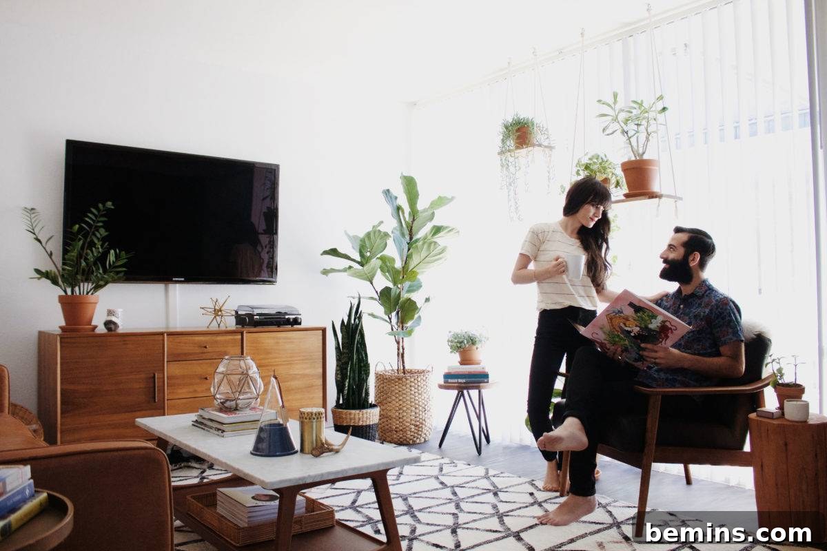 Autumn Hues: Elevating Your Living Space with Textural Accents 11 Living room with plants and natural wood elements, creating a fresh and inviting atmosphere