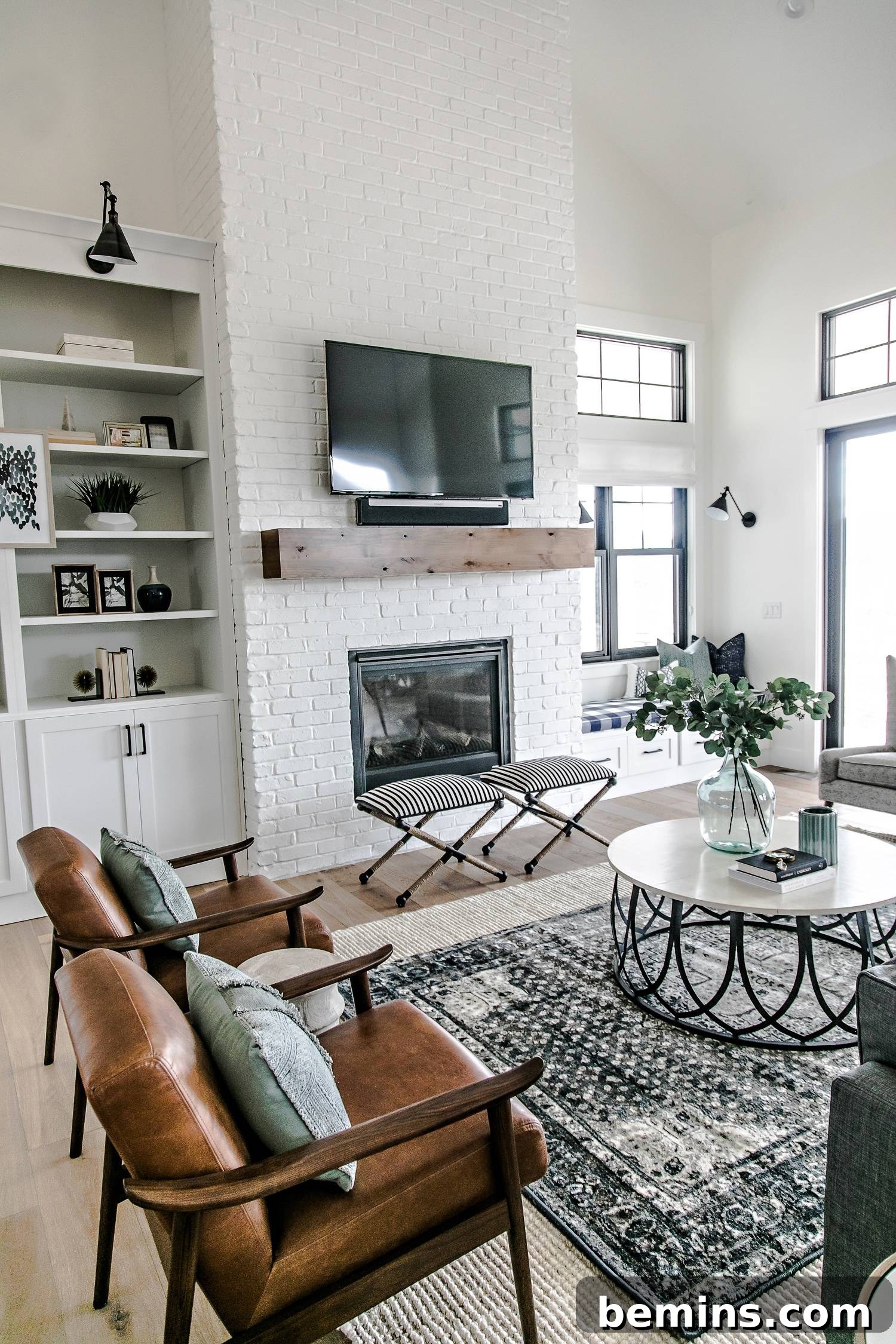 Autumn Hues: Elevating Your Living Space with Textural Accents 4 Living room featuring a jute rug layered with a smaller patterned rug, adding texture and visual interest