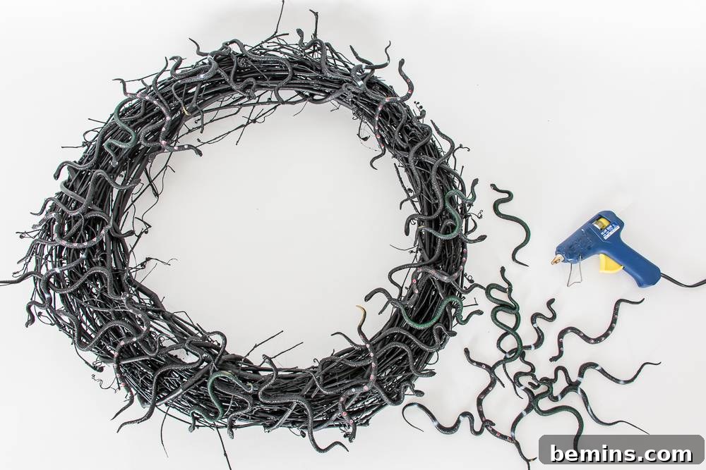 Glue the snakes to the Halloween snake wreath