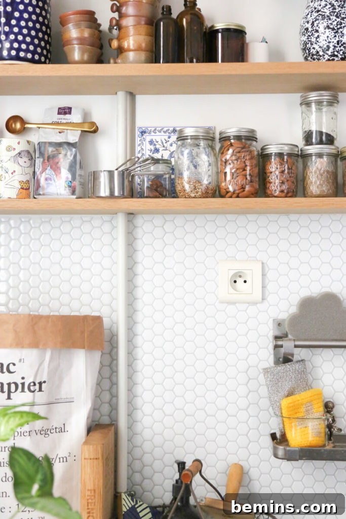 Budget-Savvy Backsplash Upgrades for Renters 6 Easy renter-friendly backsplash with tiny white hexagon tile
