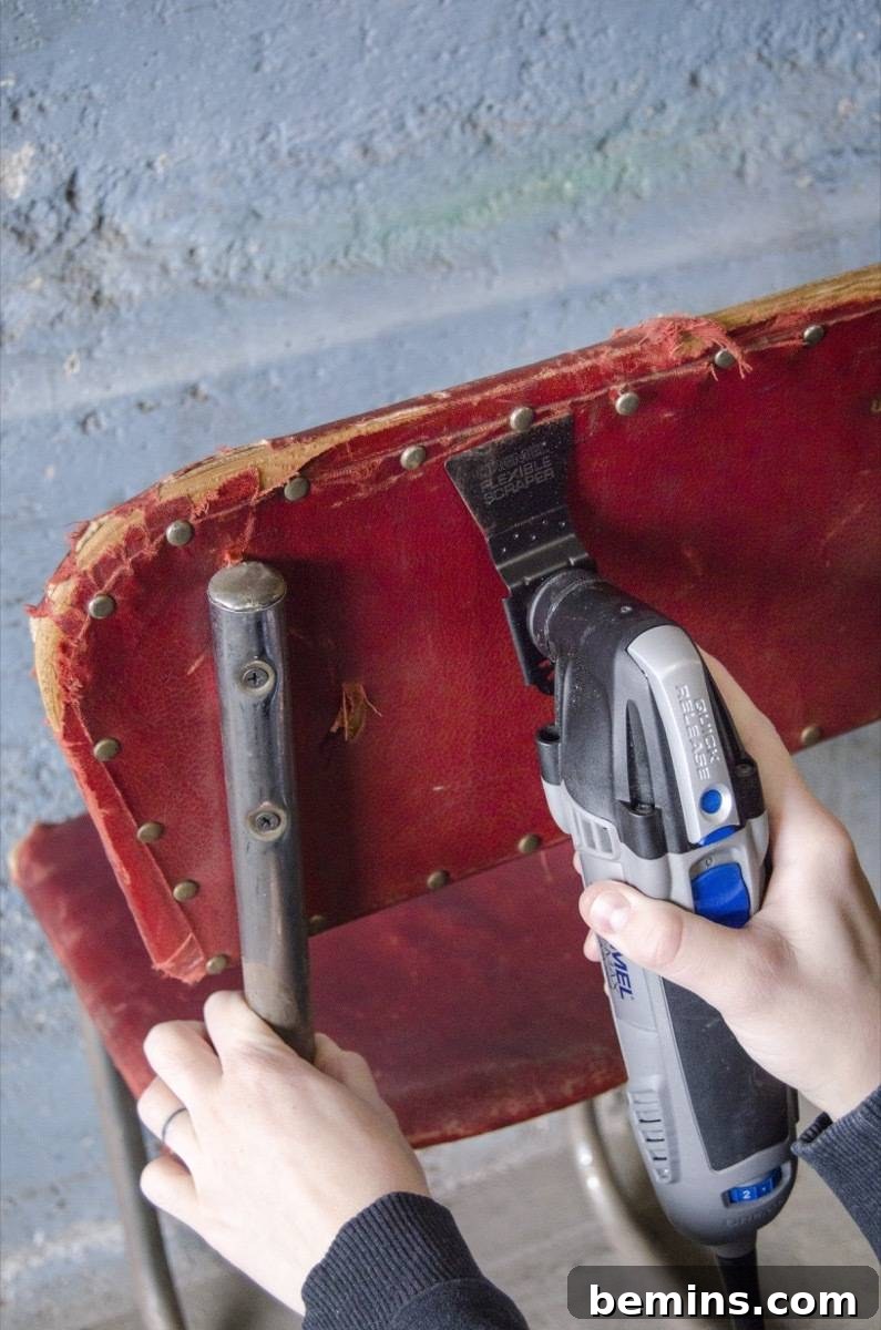 Rescued Chair's Stunning Transformation 6 Using the scrape attachment on a Dremel oscillating tool