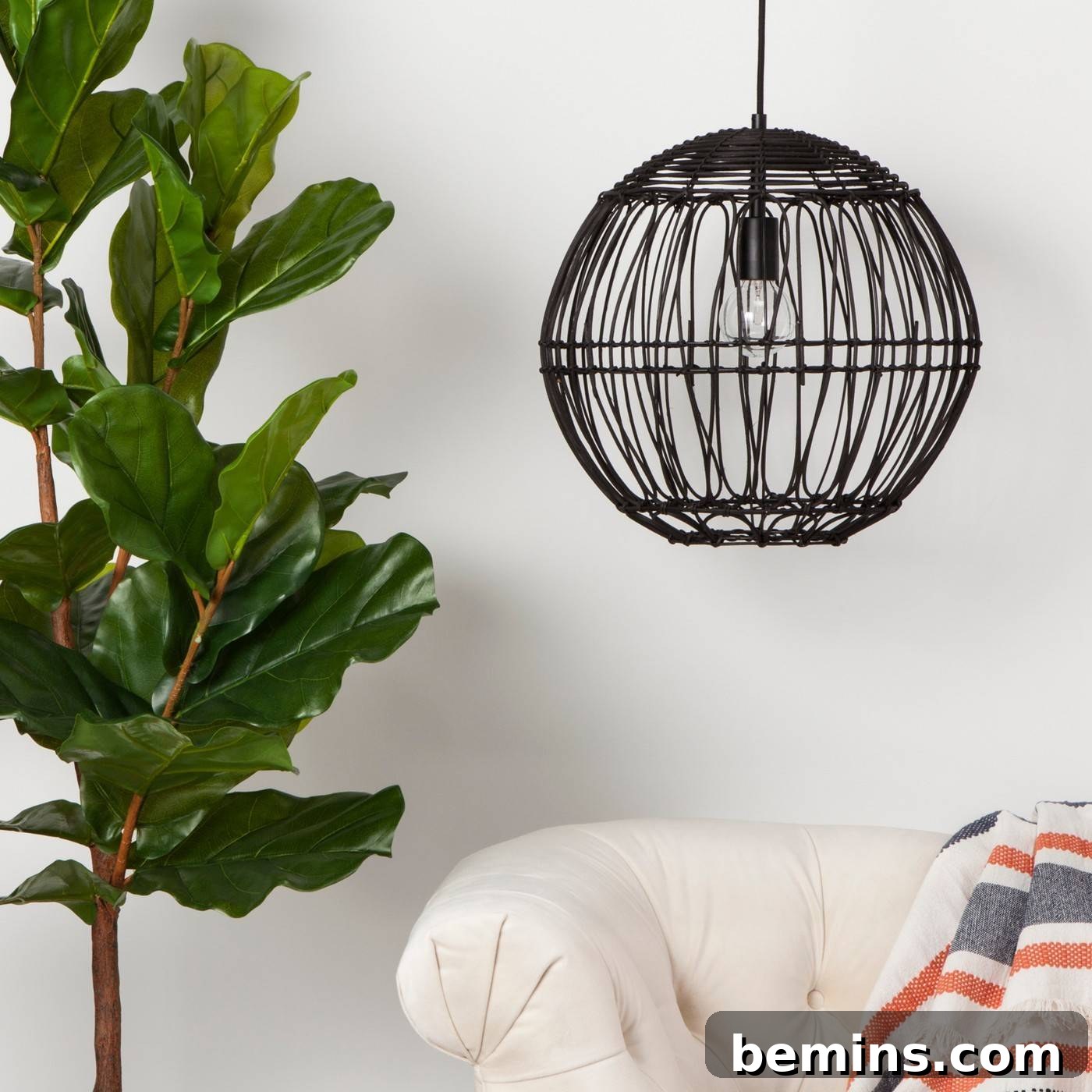 A modern black rattan globe ceiling light from Target, a stylish and affordable lighting option
