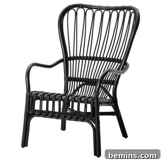A sleek black rattan armchair from Ikea, a modern take on a classic material