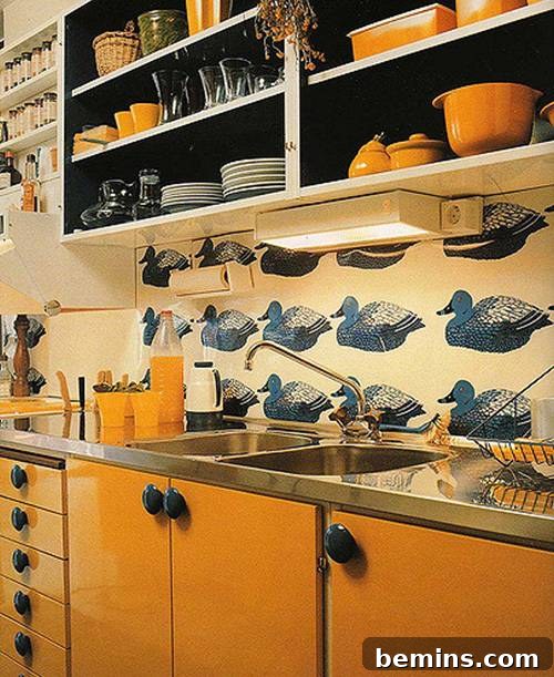 A Swedish kitchen from the 1970s featuring open shelving and stainless steel countertops.