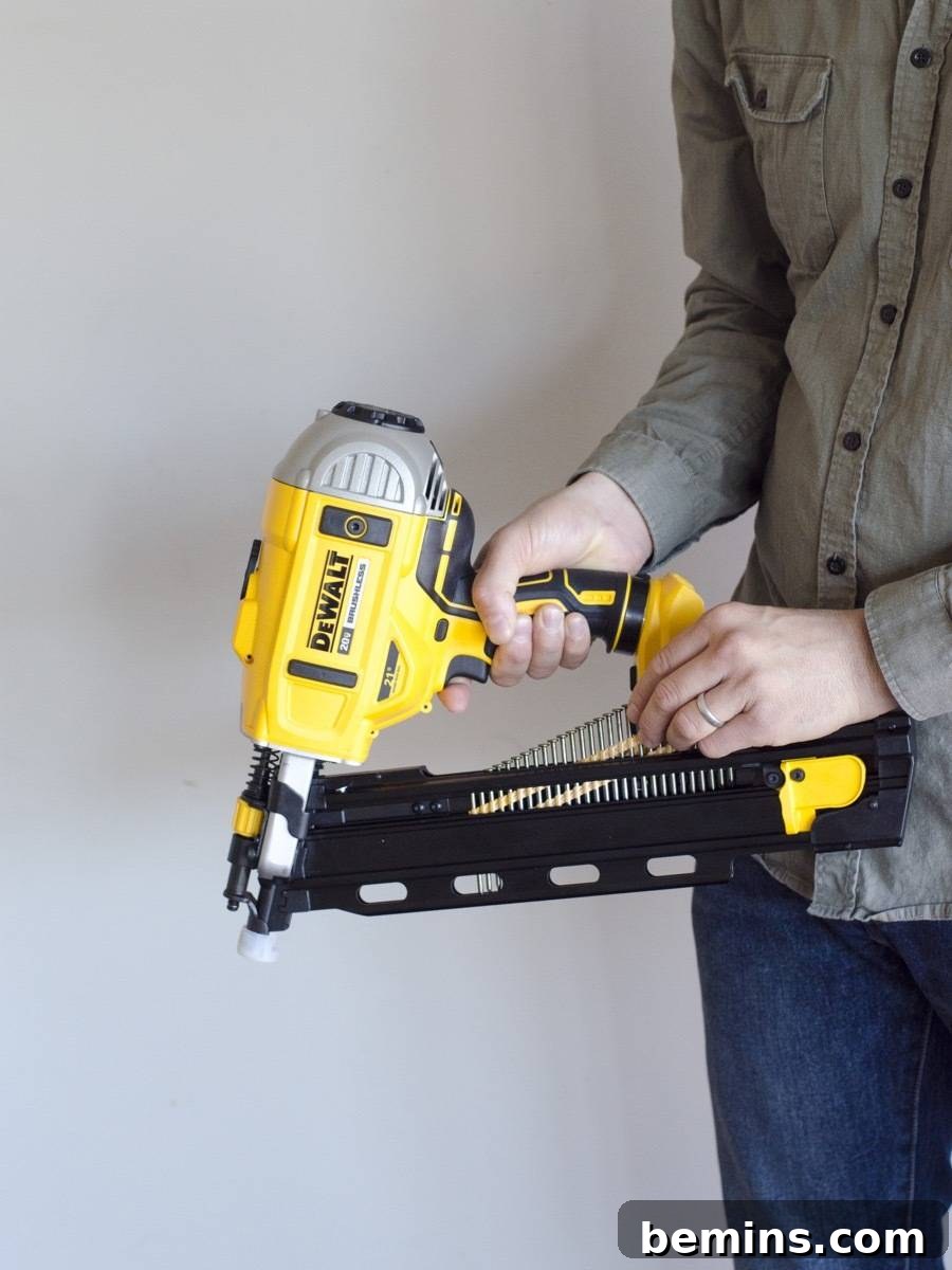 Loading nails into a framing nailer