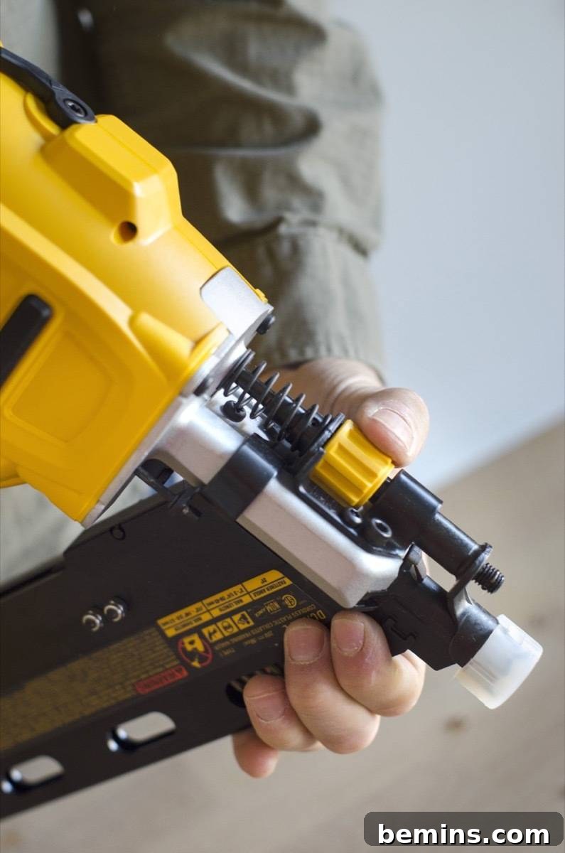 Adjusting tip of framing nailer