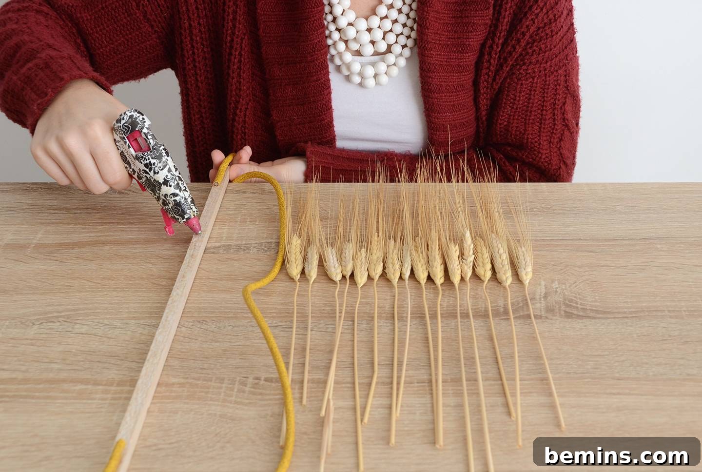 Attaching Dried Wheat to Dowel Rod