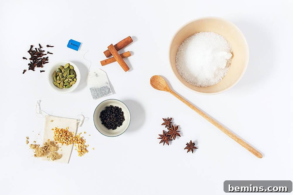 A wooden spoon and containers sitting with spices.
