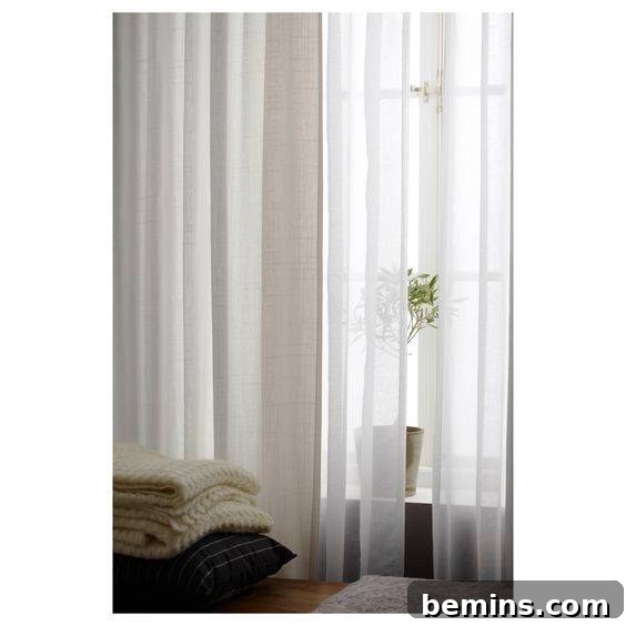 Long white curtains are a staple of Scandinavian style