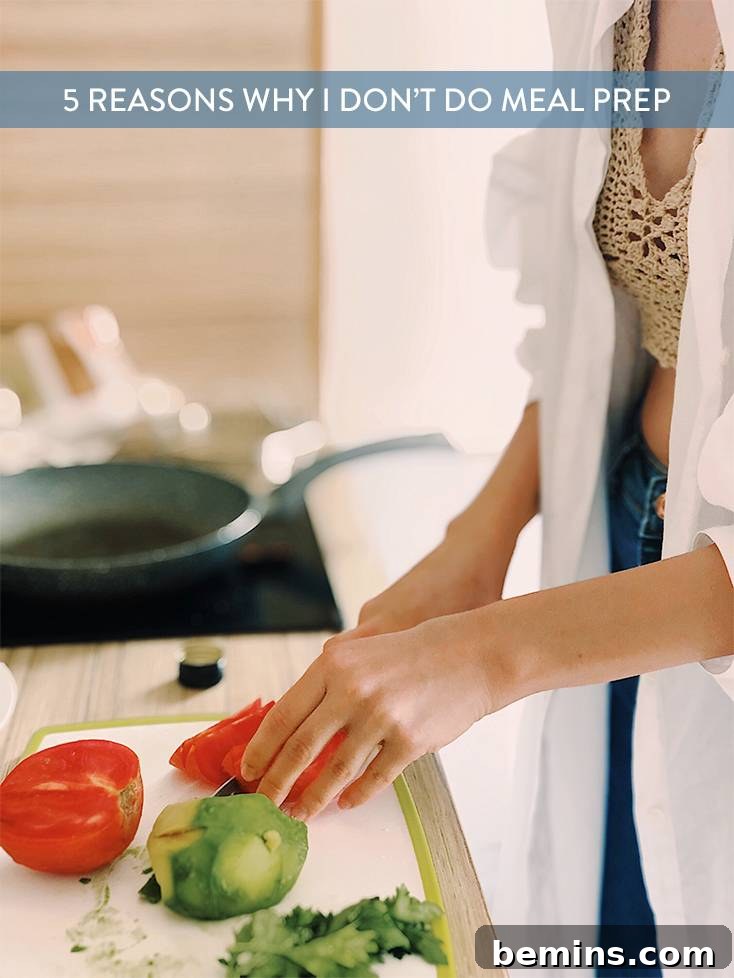 A woman slicing tomatoes in a kitchen, preparing fresh ingredients for a meal.