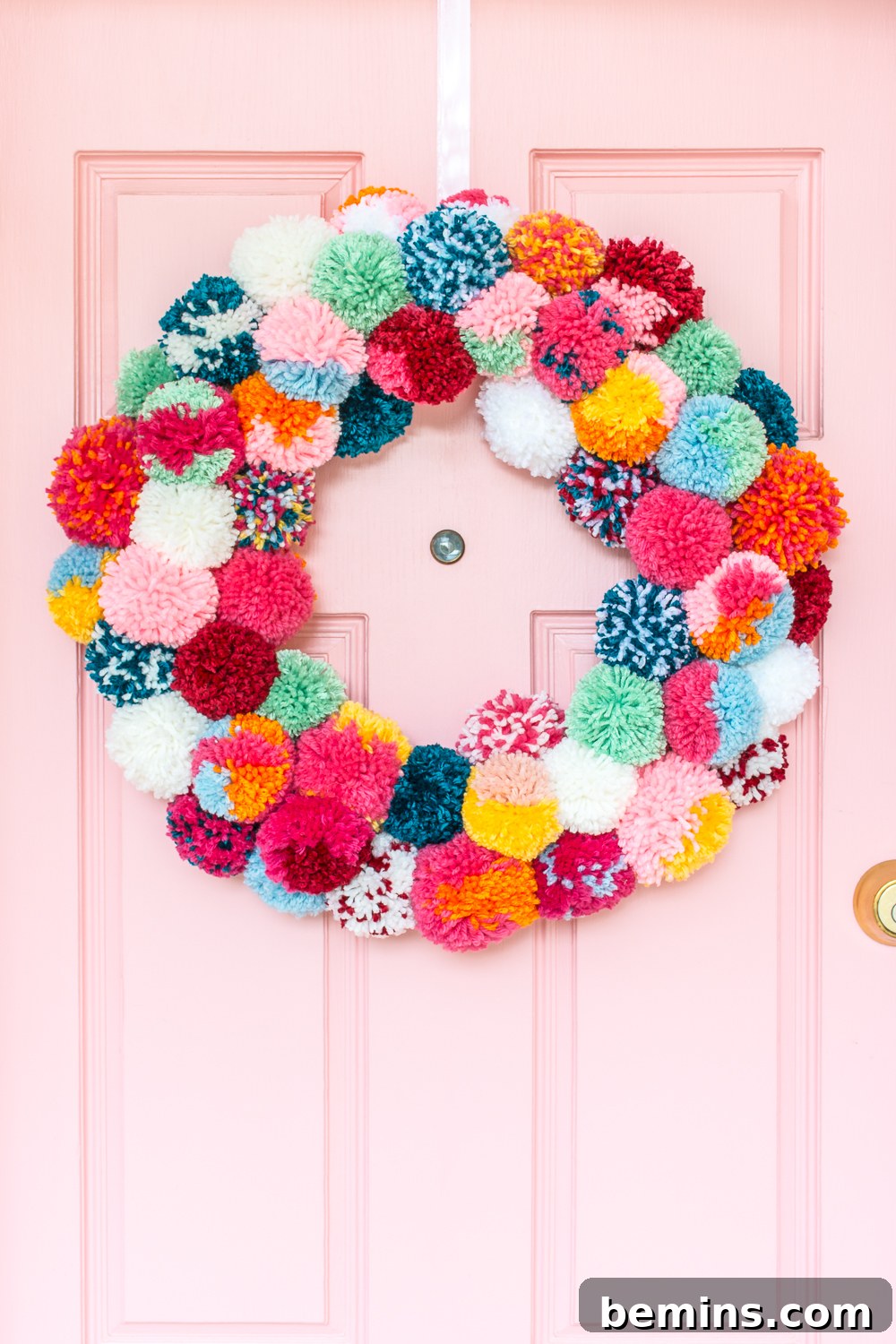 A Vibrant Boho Holiday Pom Pom Wreath 2 Bright and colorful DIY boho holiday pom-pom wreath