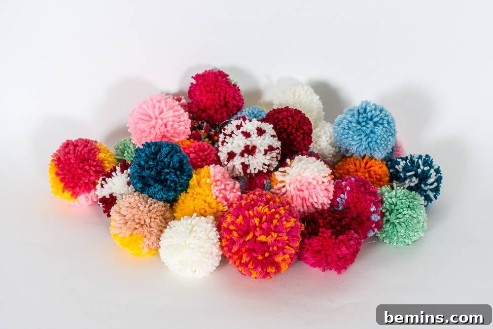 A Vibrant Boho Holiday Pom Pom Wreath 5 Pile of pom-poms