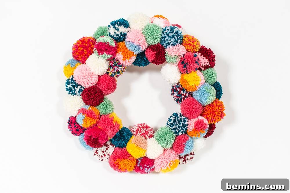 A Vibrant Boho Holiday Pom Pom Wreath 8 Colorful boho pom-pom wreath