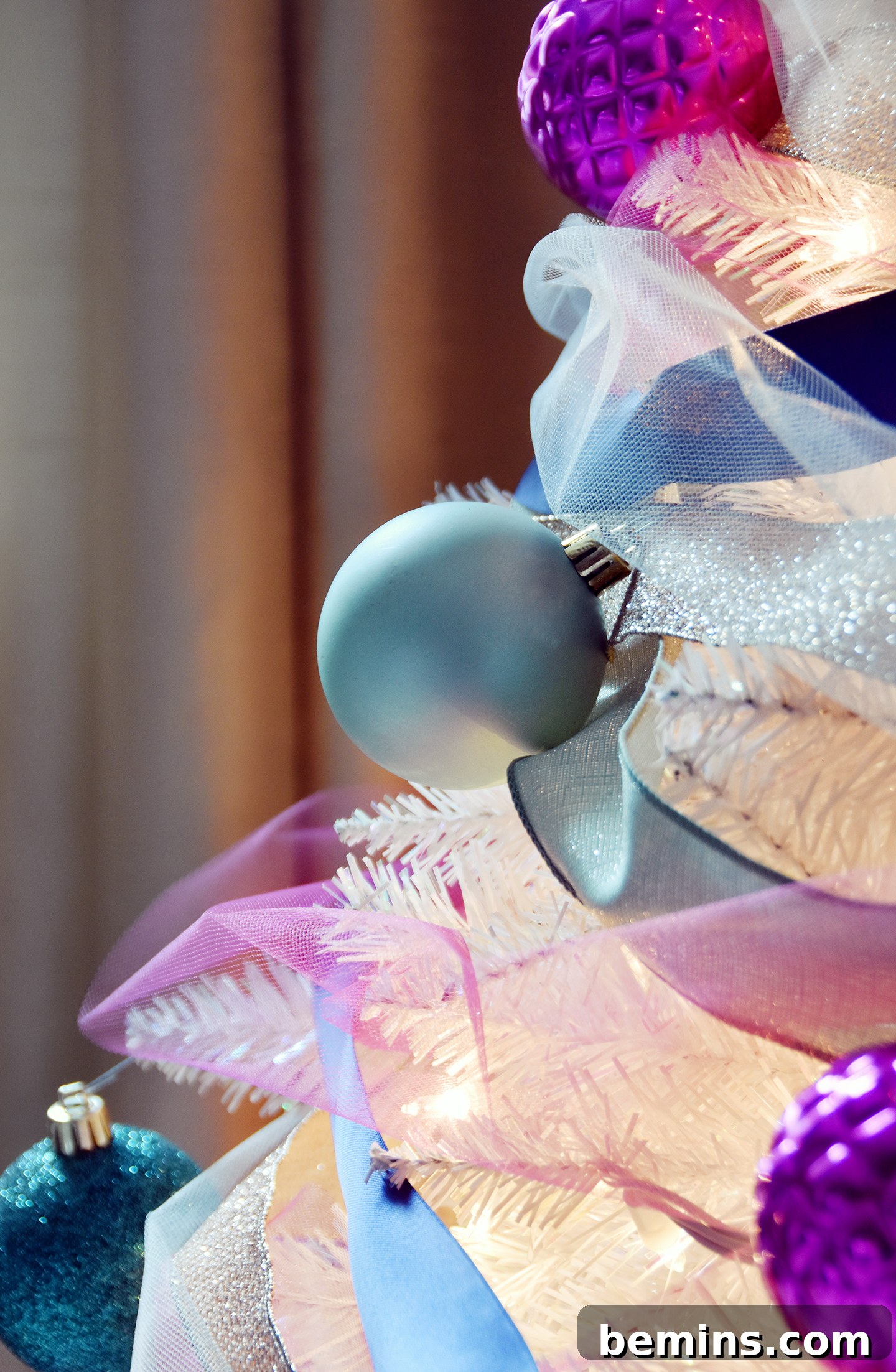 Christmas tree decorated with colorful ribbons
