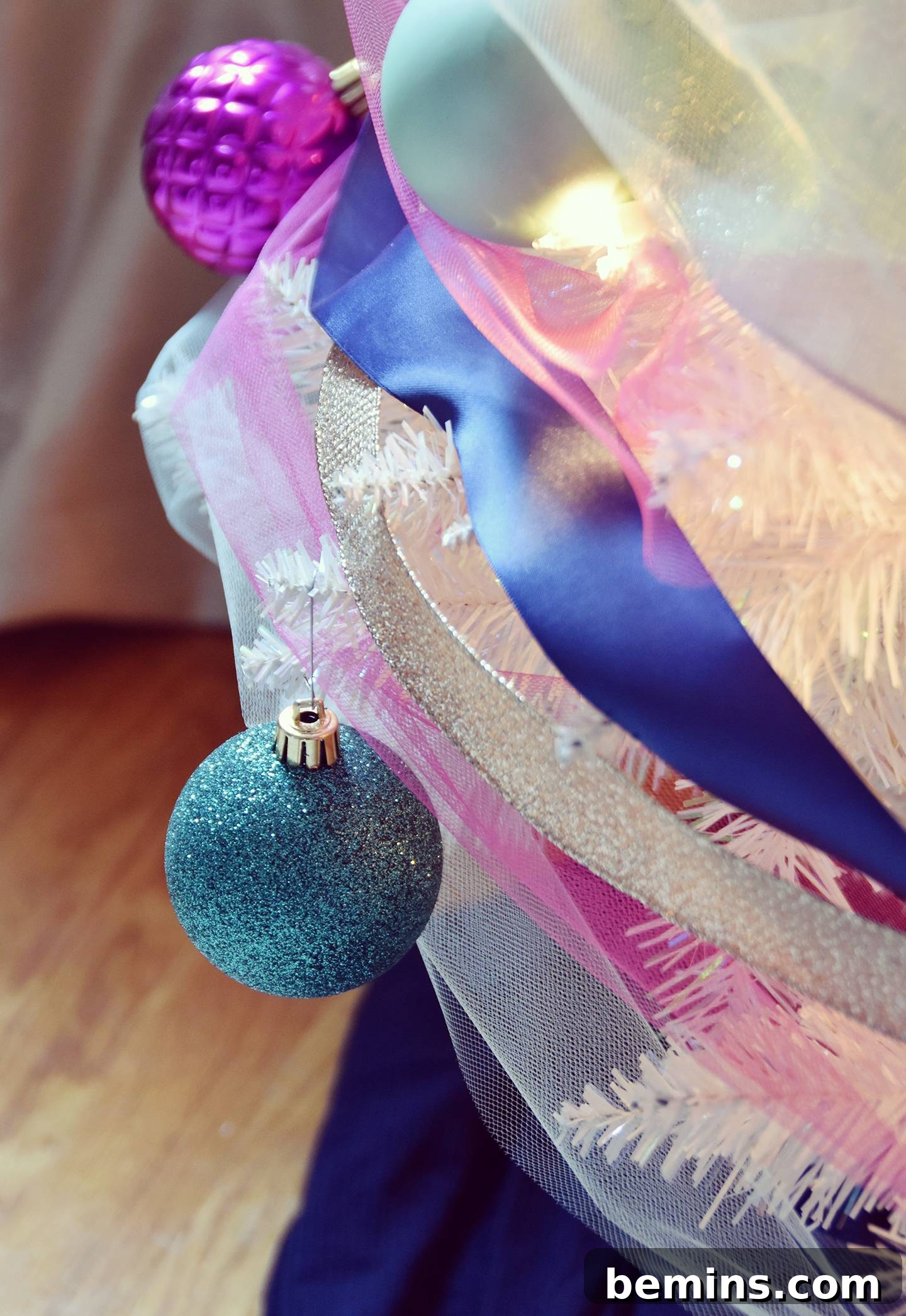 Christmas tree decorated with ribbon and ornaments