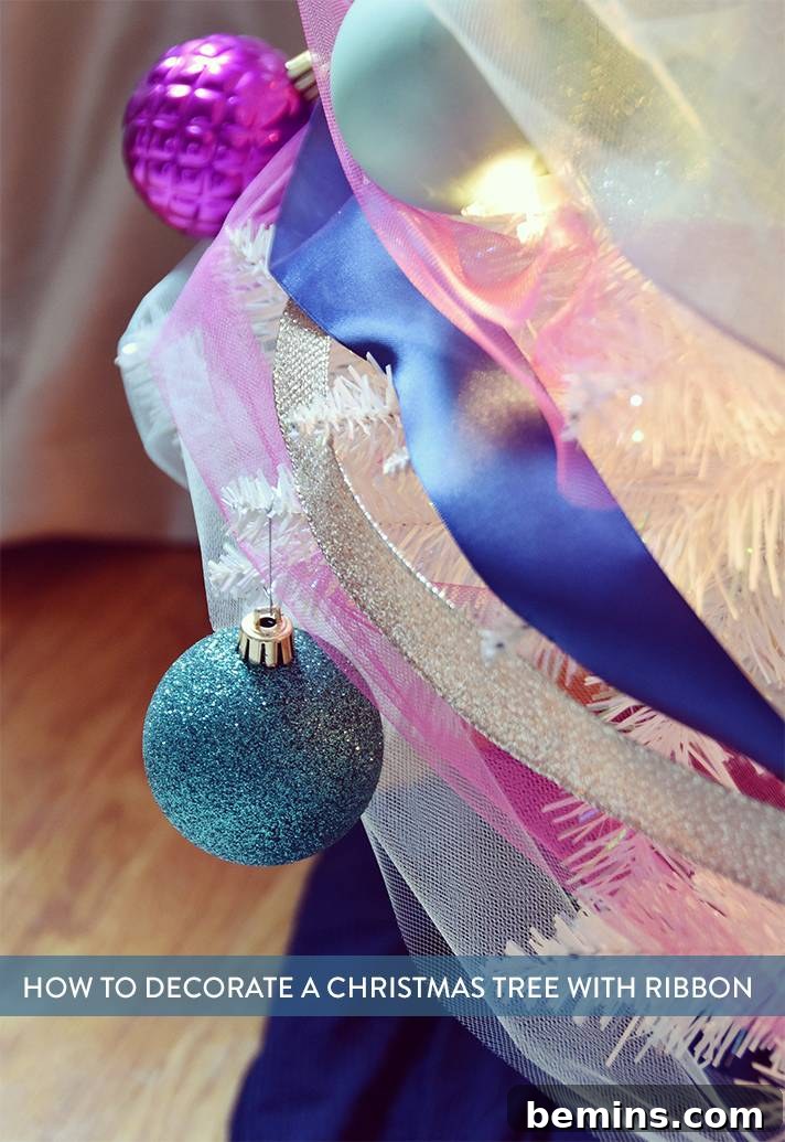 Christmas tree decorated with ribbon and ornaments, ready for the holidays