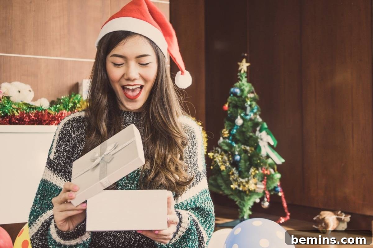 A woman exchanging Christmas gifts at a holiday party.