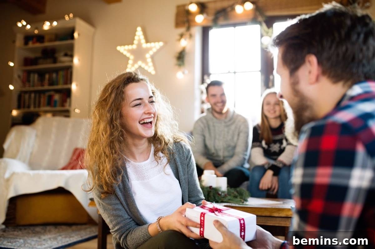 A group of teenagers celebrating Christmas and exchanging gifts.