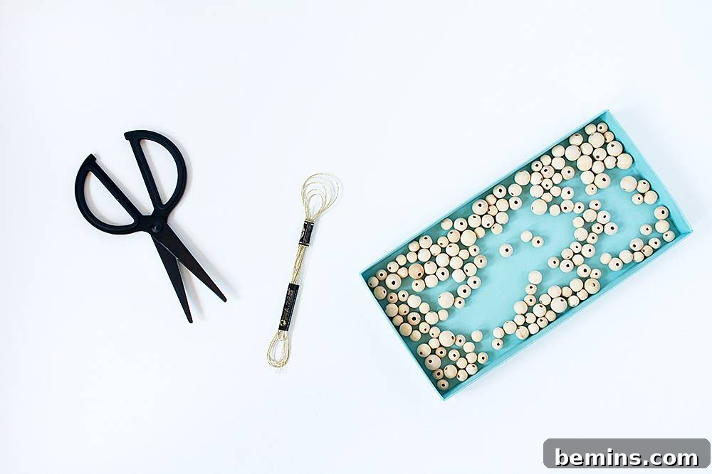 Scissors and other tools near beads.