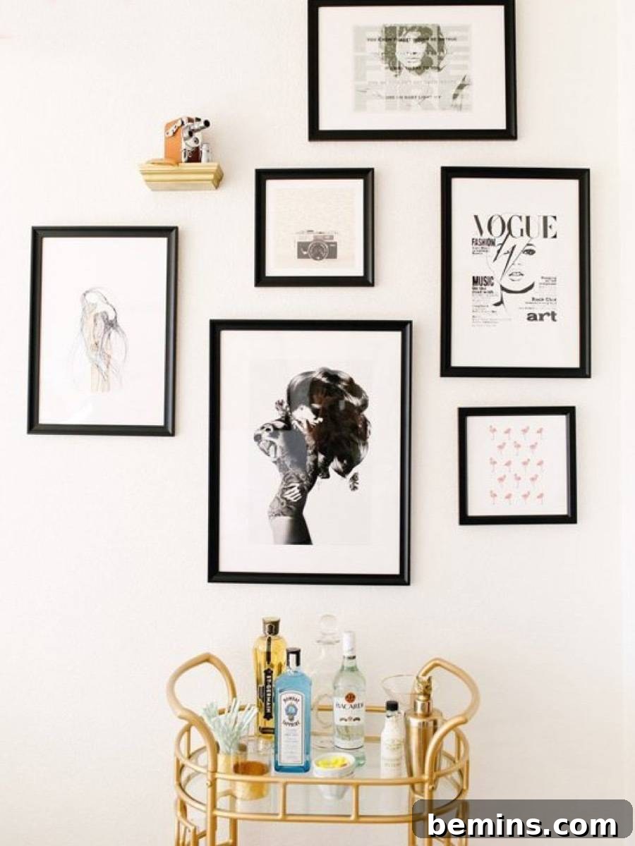 White wall of a home with an interior design of multiple paintings framed on the wall.