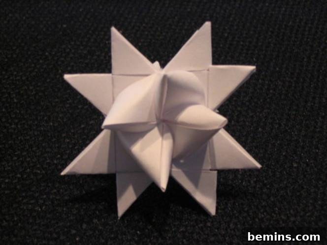 A white folded paper star. Trimming the ends gives the star a polished appearance.