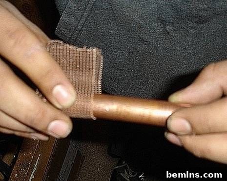 Unleash Your Inner Craftsman: Mastering the Art of Copper Pipe Soldering 4 A close-up of a clean copper pipe, emphasizing the importance of using clean materials for successful soldering and leak prevention.