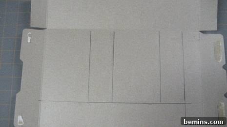 Image depicting a flattened cardboard box with various lines drawn on it, indicating the measurements for the gift box.