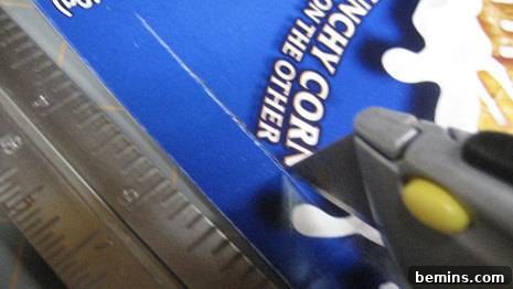 Image demonstrating the process of using a tool and ruler to create the slot for the tab on the gift box.
