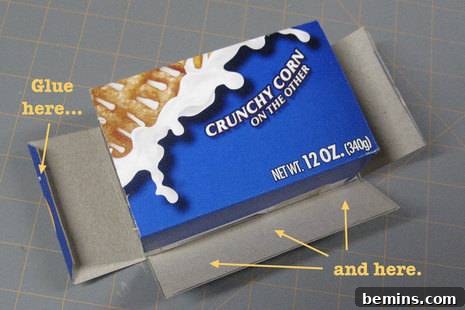 Image showing the cereal box pieces being glued together to form the final gift box shape.