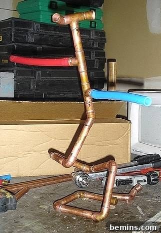 Crafting Copper Art Projects with New Soldering Skills 9 The finished abstract copper pipe sculpture, a testament to creative soldering and artistic vision, not designed for practicality but for aesthetic appeal.