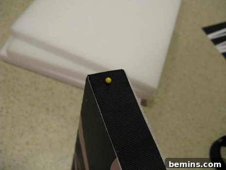 Creating Dimensional Wall Decor from Foam 6 A black item sits next to three blocks.